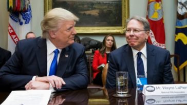 Trump and LaPierre smile at each other