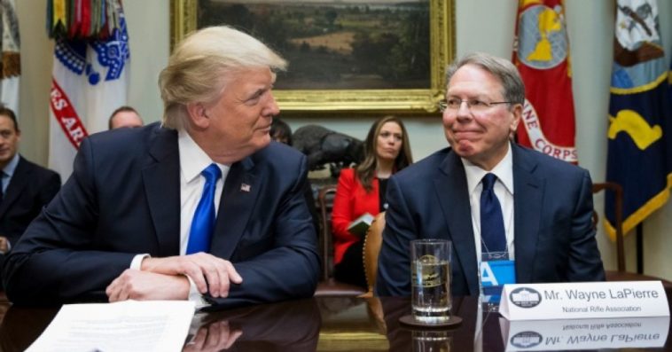 Trump and LaPierre smile at each other